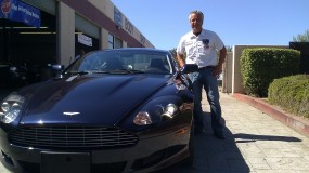 Larry Biral by newly refinished Aston Martin DB9